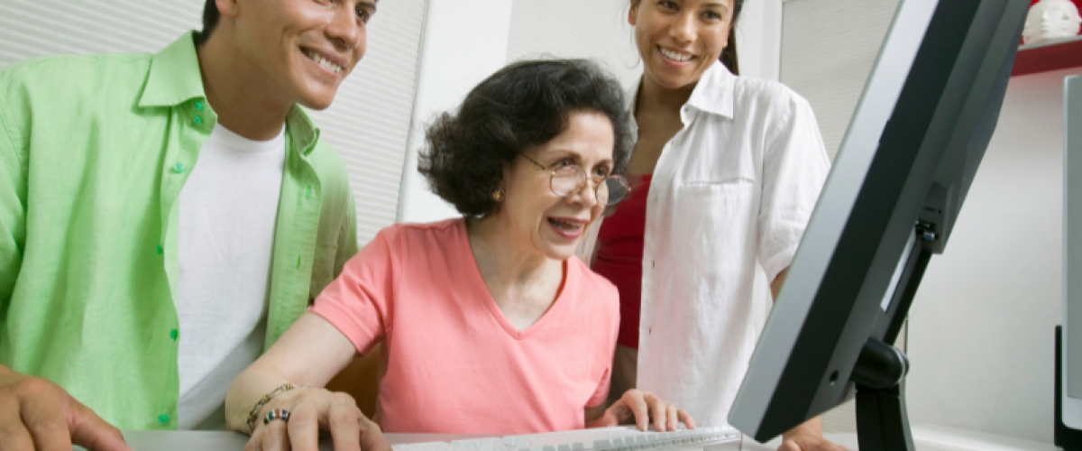 3 women looking at computer screen